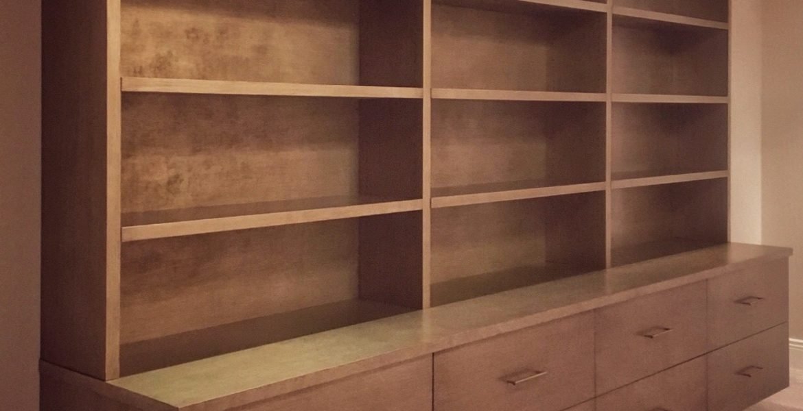 contemporary floating wall unit with a textured silver-gold finish