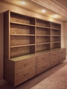 contemporary floating wall unit with a textured silver-gold finish