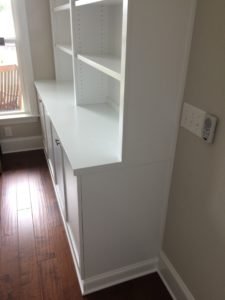 shaker-style wall storage unit with crisp white finish