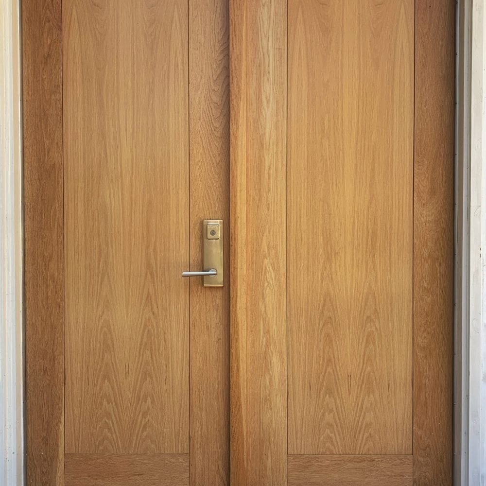 white oak entrance doors with double insulated flat panel