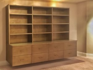 contemporary floating wall unit with a textured silver-gold finish