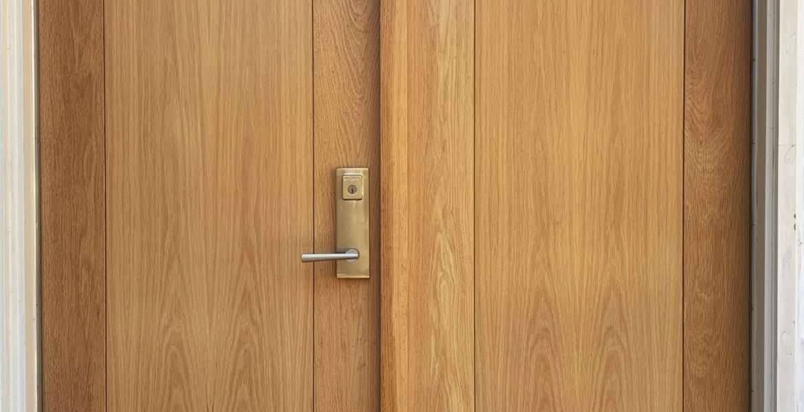 white oak entrance doors with double insulated flat panel