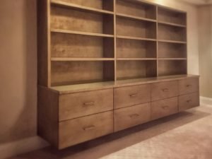 contemporary floating wall unit with textured silver-gold finish